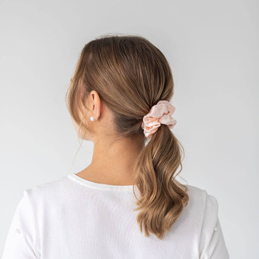Brown hair styled with a peach wide silk scrunchie 3.5 cm voluminous hair tie from behind