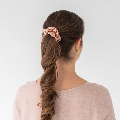 Brown hair styled with an extra glossy rosegold wide silk scrunchie 3.5 cm voluminous hair tie from behind