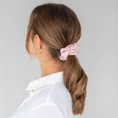 Brown hair styled with a pink wide silk scrunchie 3.5 cm voluminous hair tie from behind